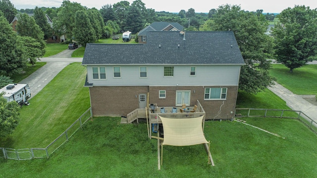 106 Squires Pointe Rd, Paris, KY 40361 - rear view of house with a fenced backyard, view of wooded area, roof with shingles, and brick siding