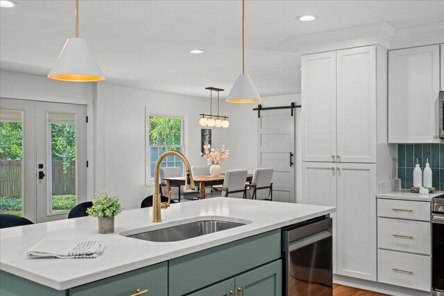 2940 Southview Dr, Lexington, KY 40503 - kitchen with green cabinets, stainless steel dishwasher, white cabinetry, a barn door, and recessed lighting