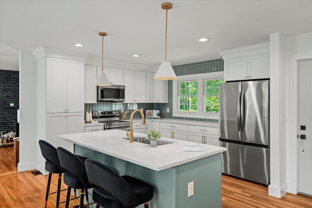 2940 Southview Dr, Lexington, KY 40503 - kitchen with stainless steel appliances, light wood-style floors, white cabinets, and recessed lighting