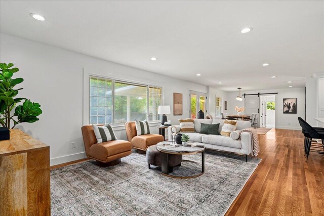 2940 Southview Dr, Lexington, KY 40503 - living area featuring a barn door, recessed lighting, and light wood-style floors