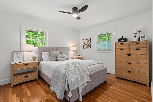 2940 Southview Dr, Lexington, KY 40503 - bedroom with multiple windows, wood finished floors, and ceiling fan