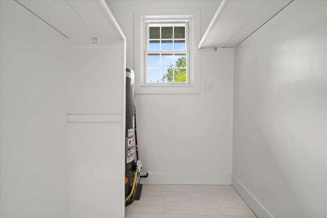 2940 Southview Dr, Lexington, KY 40503 - laundry room featuring marble look tiles and gas water heater