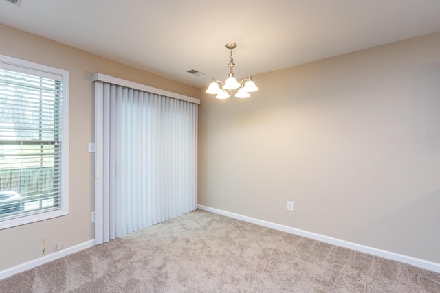 3123 Daly Pl, Lexington, KY 40511 - spare room featuring a chandelier, carpet flooring, and healthy amount of natural light