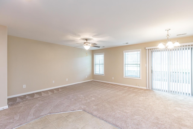 3123 Daly Pl, Lexington, KY 40511 - unfurnished room with light colored carpet, a chandelier, and ceiling fan