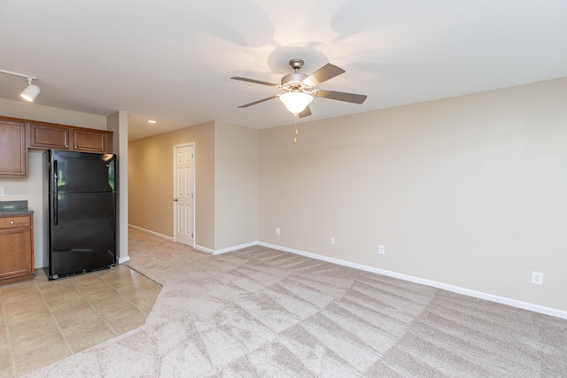 3123 Daly Pl, Lexington, KY 40511 - kitchen featuring freestanding refrigerator, ceiling fan, brown cabinetry, and light colored carpet