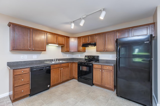 3123 Daly Pl, Lexington, KY 40511 - kitchen with black appliances, under cabinet range hood, brown cabinetry, and dark stone countertops