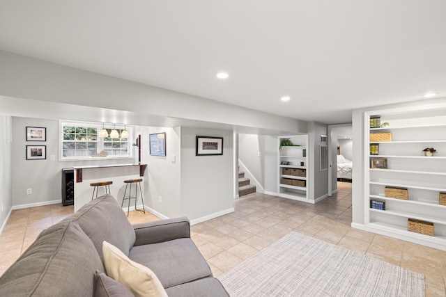 110 Flinn Ct, Georgetown, KY 40324 - tiled living area with built in features, stairs, a dry bar, and recessed lighting