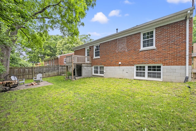 110 Flinn Ct, Georgetown, KY 40324 - rear view of house with an outdoor fire pit and brick siding