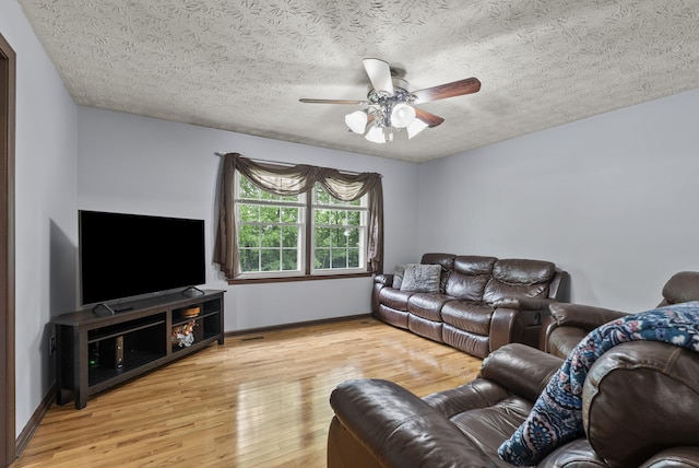 1651 Waits Rd, Cynthiana, KY 41031 - living area featuring a ceiling fan, wood finished floors, and a textured ceiling
