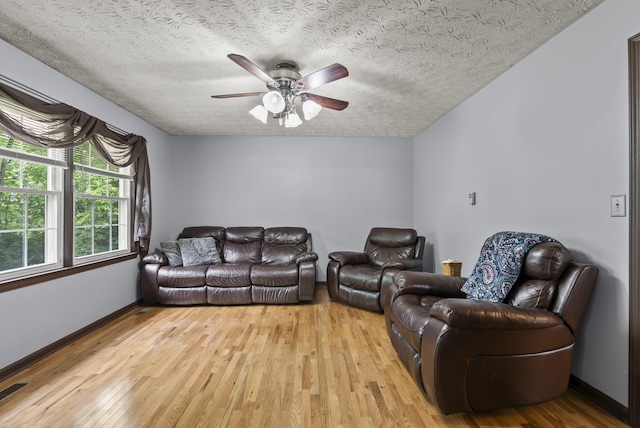 1651 Waits Rd, Cynthiana, KY 41031 - living area with light wood-style floors, a ceiling fan, and a textured ceiling