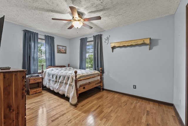 1651 Waits Rd, Cynthiana, KY 41031 - bedroom featuring light wood-type flooring, a textured ceiling, and ceiling fan
