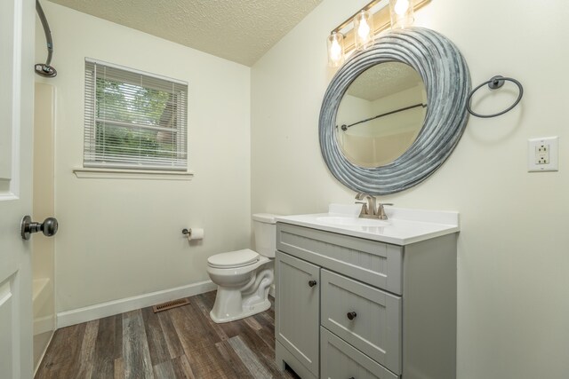 242 Possum Ridge Rd, West Liberty, KY 41472 - full bath with wood finished floors, vanity, and a textured ceiling