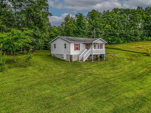 242 Possum Ridge Rd, West Liberty, KY 41472 - view of front facade with stairs, a front yard, and a view of trees