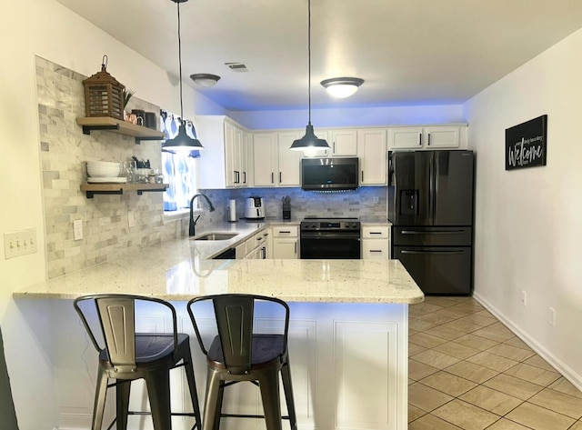 2368 Lonan Ct, Lexington, KY 40511 - kitchen featuring stainless steel appliances, a peninsula, backsplash, white cabinets, and light stone countertops