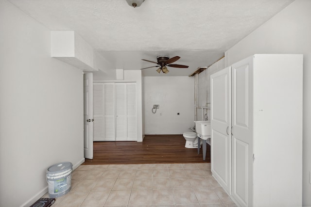 720 Pinoak Dr, Nicholasville, KY 40356 - bathroom with a ceiling fan, tile patterned flooring, a bidet, and a textured ceiling
