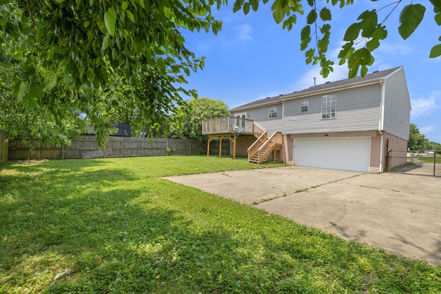 720 Pinoak Dr, Nicholasville, KY 40356 - rear view of house with stairway, an attached garage, a deck, and a fenced backyard