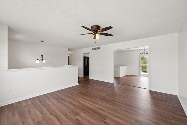 720 Pinoak Dr, Nicholasville, KY 40356 - unfurnished living room with a chandelier, dark wood-style flooring, and a ceiling fan