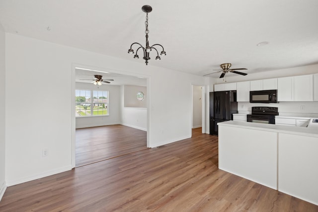 720 Pinoak Dr, Nicholasville, KY 40356 - kitchen with black appliances, light wood finished floors, light countertops, white cabinets, and ceiling fan