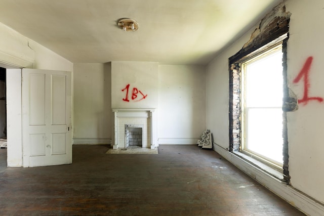 411 High St, Paris, KY 40361 - unfurnished living room featuring a fireplace with flush hearth and wood finished floors