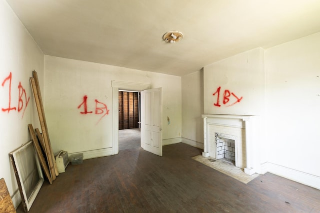 411 High St, Paris, KY 40361 - unfurnished living room with wood finished floors and a fireplace with flush hearth