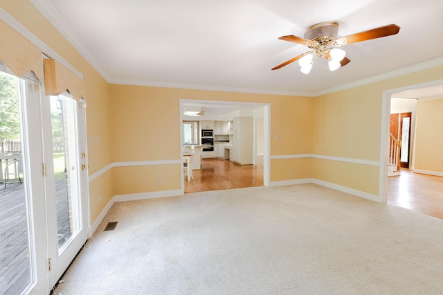 6011 Canonero Way, Versailles, KY 40383 - spare room featuring light carpet, crown molding, and ceiling fan