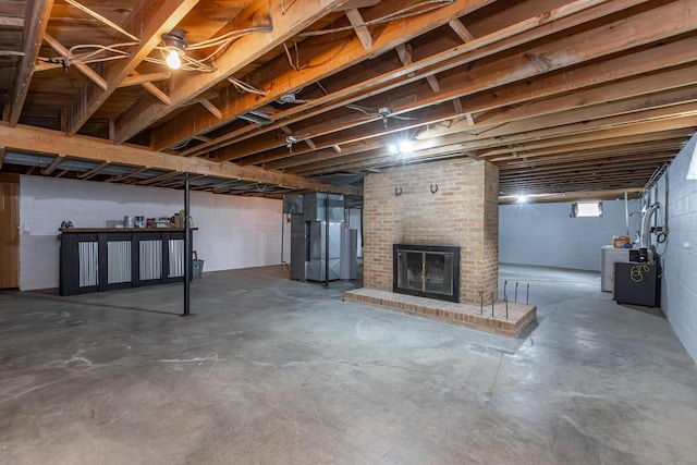 111 Hagan Ct, Lancaster, KY 40444 - below grade area featuring washer / clothes dryer, a fireplace, and concrete block wall