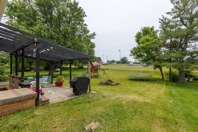 111 Hagan Ct, Lancaster, KY 40444 - view of grassy yard featuring a trampoline, a playground, a patio, and a pergola