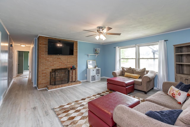 111 Hagan Ct, Lancaster, KY 40444 - living area with light wood finished floors, a fireplace, a ceiling fan, and crown molding