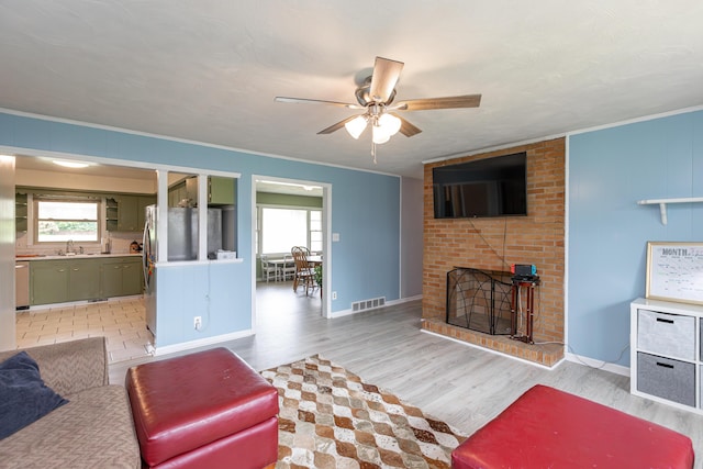 111 Hagan Ct, Lancaster, KY 40444 - living area featuring healthy amount of natural light, a ceiling fan, light wood-type flooring, and ornamental molding