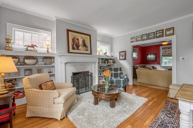 315 Desha Rd, Lexington, KY 40502 - living area featuring hardwood / wood-style flooring, ornamental molding, and a fireplace