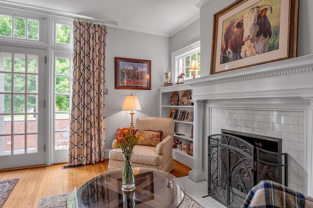 315 Desha Rd, Lexington, KY 40502 - sitting room featuring hardwood / wood-style flooring, a brick fireplace, and crown molding