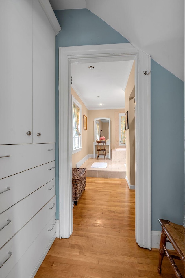 315 Desha Rd, Lexington, KY 40502 - corridor featuring light wood-type flooring, arched walkways, ornamental molding, and lofted ceiling
