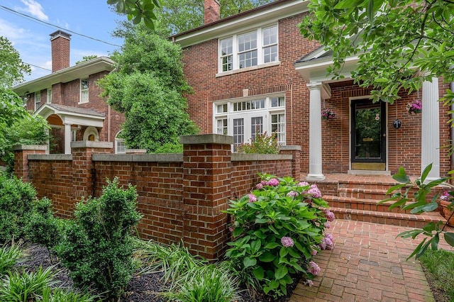 315 Desha Rd, Lexington, KY 40502 - view of front facade featuring brick siding and a chimney