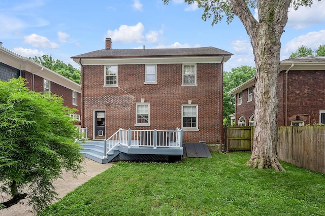 315 Desha Rd, Lexington, KY 40502 - back of house with a chimney, a wooden deck, and brick siding