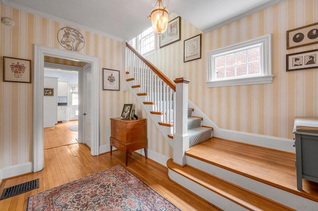 315 Desha Rd, Lexington, KY 40502 - stairway featuring wood-type flooring and ornamental molding