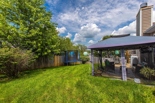 4026 Briar Creek Dr, Lawrenceburg, KY 40342 - fenced backyard featuring a trampoline, a gazebo, and a patio area