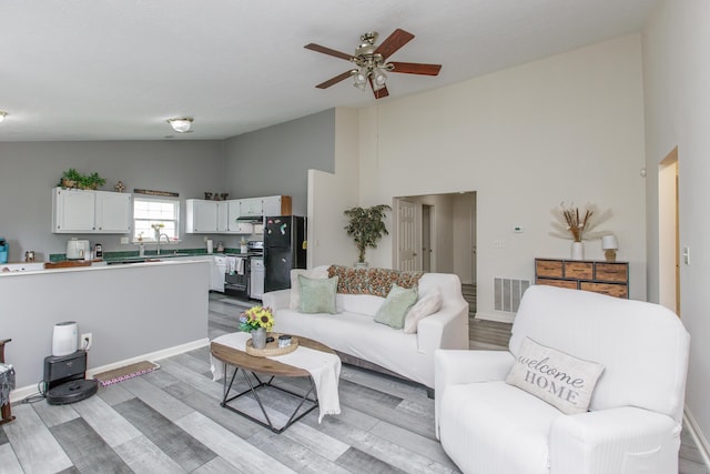 4026 Briar Creek Dr, Lawrenceburg, KY 40342 - living room featuring a ceiling fan, light wood finished floors, and high vaulted ceiling