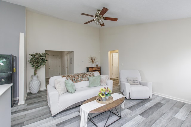 4026 Briar Creek Dr, Lawrenceburg, KY 40342 - living area with a ceiling fan, light wood-style flooring, and a high ceiling