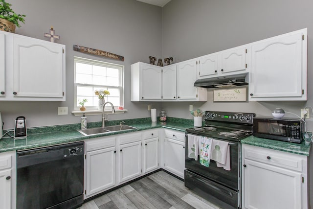 4026 Briar Creek Dr, Lawrenceburg, KY 40342 - kitchen featuring black appliances, under cabinet range hood, white cabinetry, light wood-style floors, and dark countertops