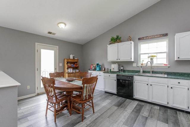 4026 Briar Creek Dr, Lawrenceburg, KY 40342 - kitchen featuring dishwasher, light wood-style flooring, white cabinets, lofted ceiling, and dark countertops