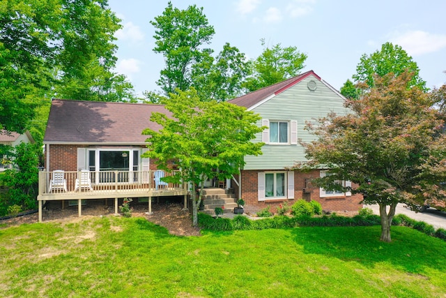 168 Perry Ln, London, KY 40741 - back of property with brick siding, a lawn, and a deck
