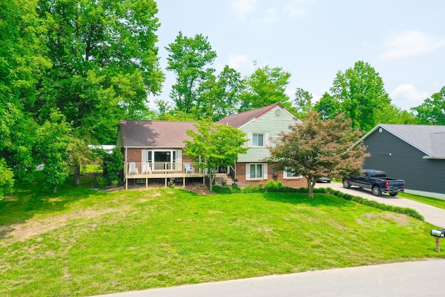 168 Perry Ln, London, KY 40741 - view of front of home with brick siding, a wooden deck, and a front yard