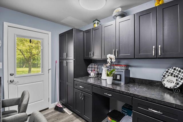 168 Perry Ln, London, KY 40741 - kitchen featuring light wood finished floors and dark stone countertops