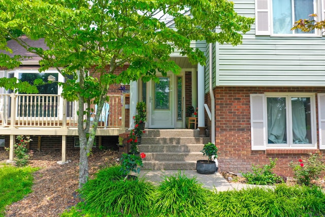 168 Perry Ln, London, KY 40741 - view of exterior entry with brick siding and a wooden deck