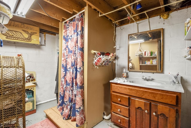 168 Perry Ln, London, KY 40741 - full bathroom with concrete flooring, vanity, a shower stall, and concrete block wall