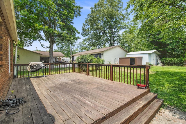 168 Perry Ln, London, KY 40741 - wooden deck featuring a lawn, grilling area, and an outdoor structure