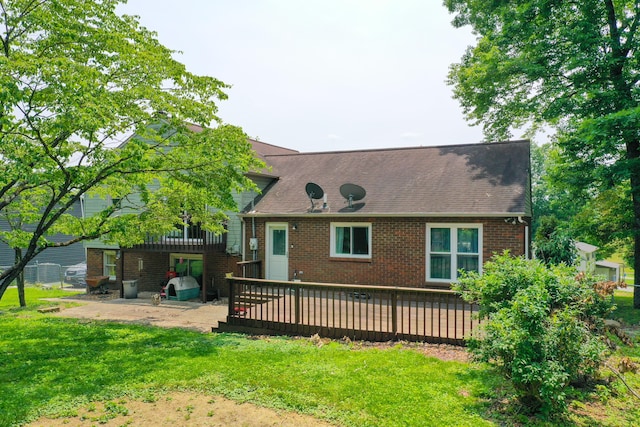 168 Perry Ln, London, KY 40741 - rear view of property featuring a patio, brick siding, roof with shingles, and a yard