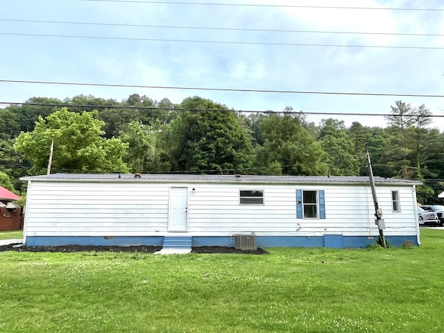 6006 US-60, Morehead, KY 40351 - view of front of house with a front yard, entry steps, crawl space, a metal roof, and a forest view