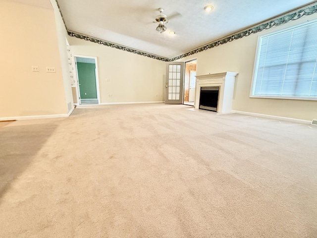 1012 Heathcliff Dr, Richmond, KY 40475 - unfurnished living room featuring a fireplace with flush hearth, carpet flooring, and healthy amount of natural light