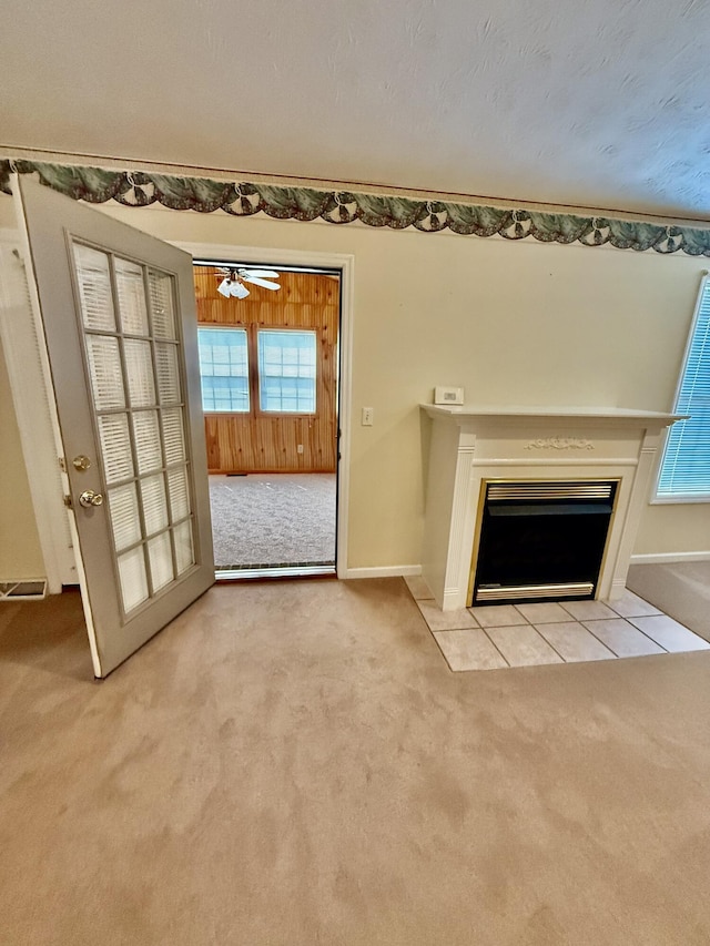 1012 Heathcliff Dr, Richmond, KY 40475 - unfurnished living room featuring light colored carpet, a fireplace with flush hearth, plenty of natural light, and a ceiling fan